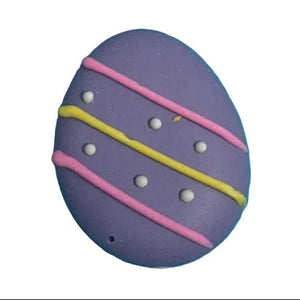Four colorful Easter egg-shaped sugar topper with decorative patterns on a white background