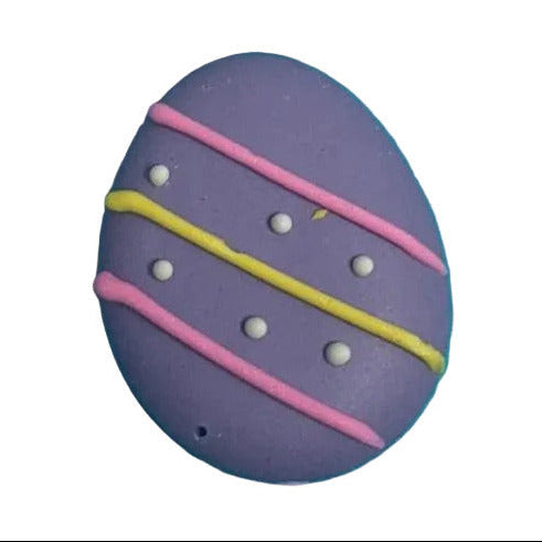 Four colorful Easter egg-shaped sugar topper with decorative patterns on a white background