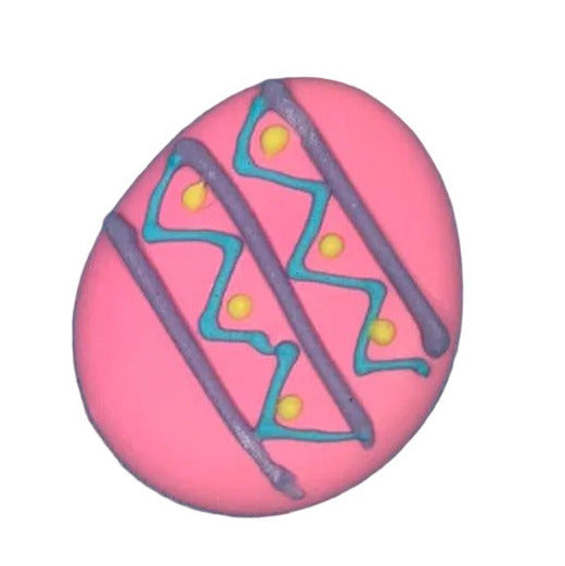 Four colorful Easter egg-shaped royal icing toppers with decorative patterns on a white background