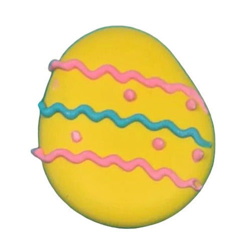 Four colorful Easter egg-shaped royal icing toppers with decorative patterns on a white background