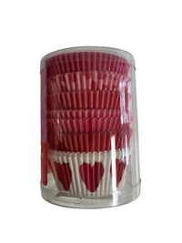 Clear cylindrical container filled with red and white cupcake liners on a light gray background