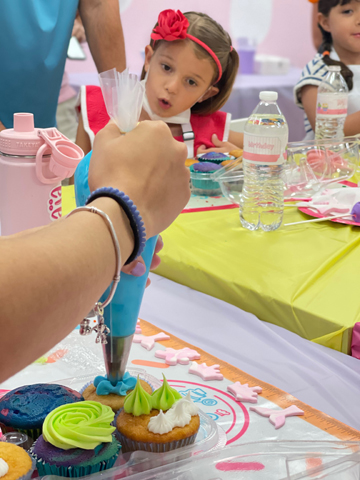 Decorating cupcakes at a birthday party