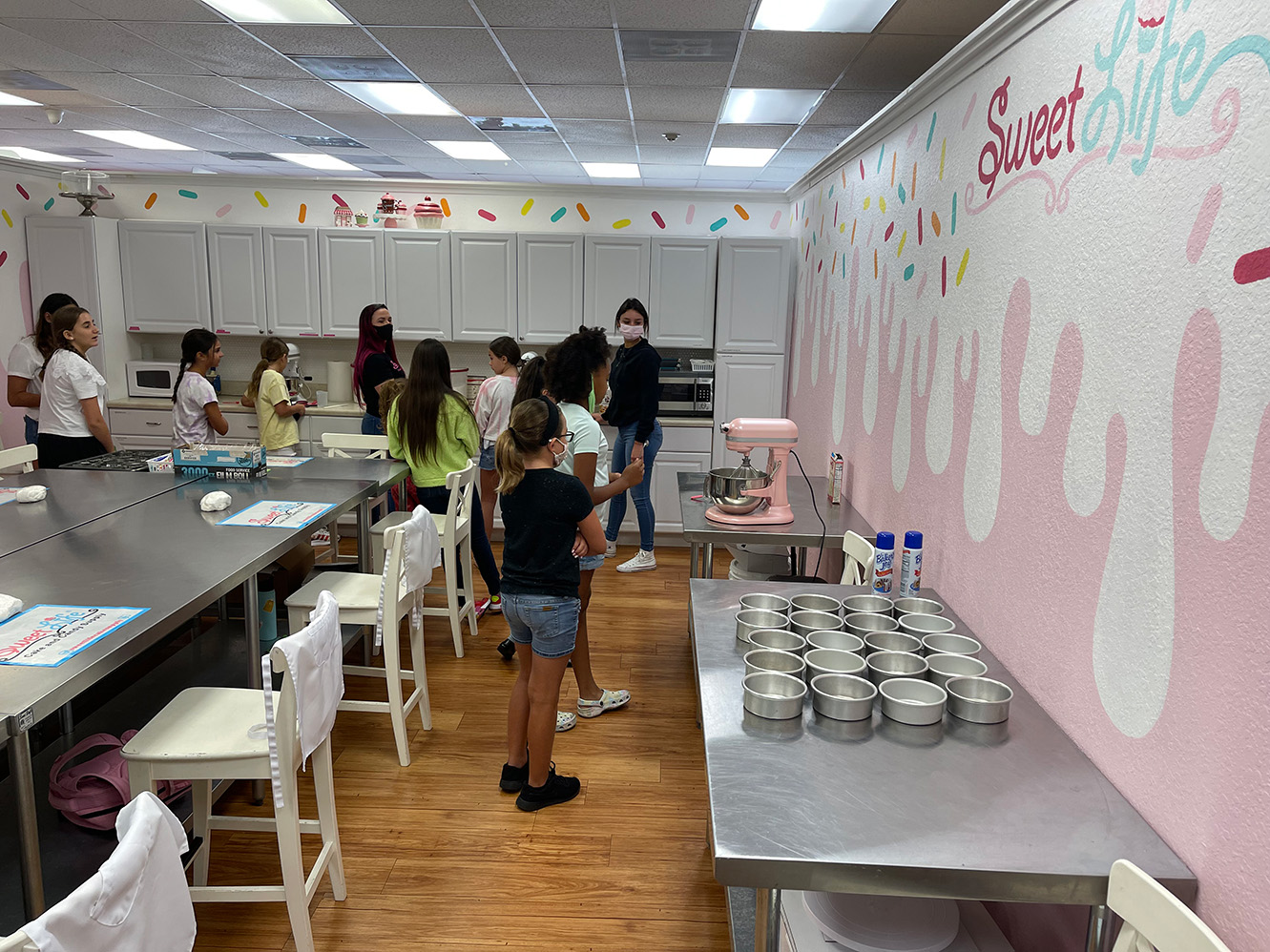 Children in the classroom learning about baking and cake decorating